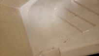 Dirty tub in shower