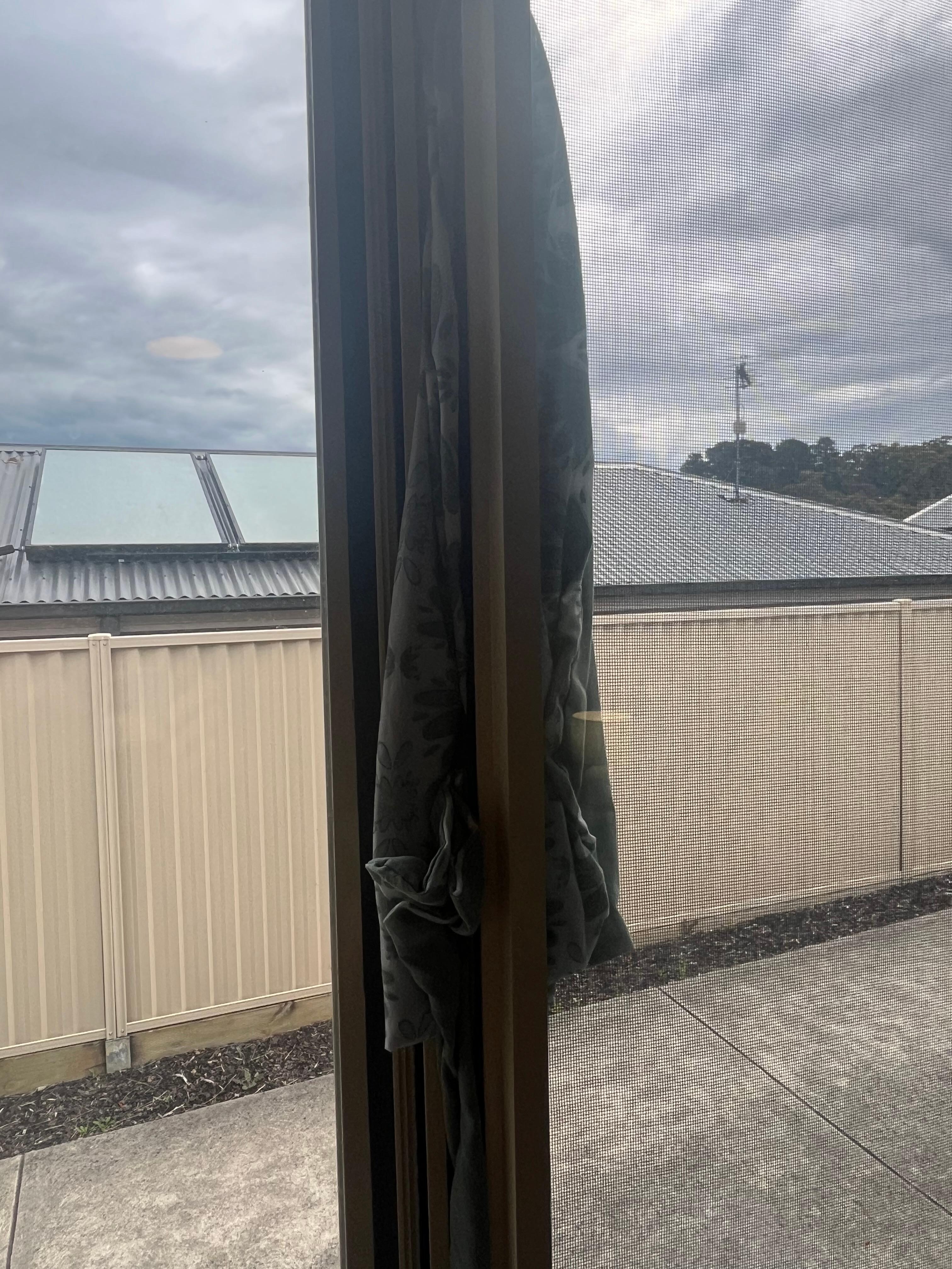 Window held shut by blanket 