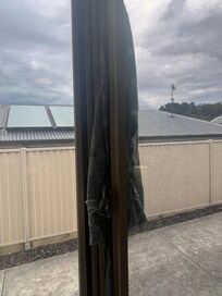 Window held shut by blanket