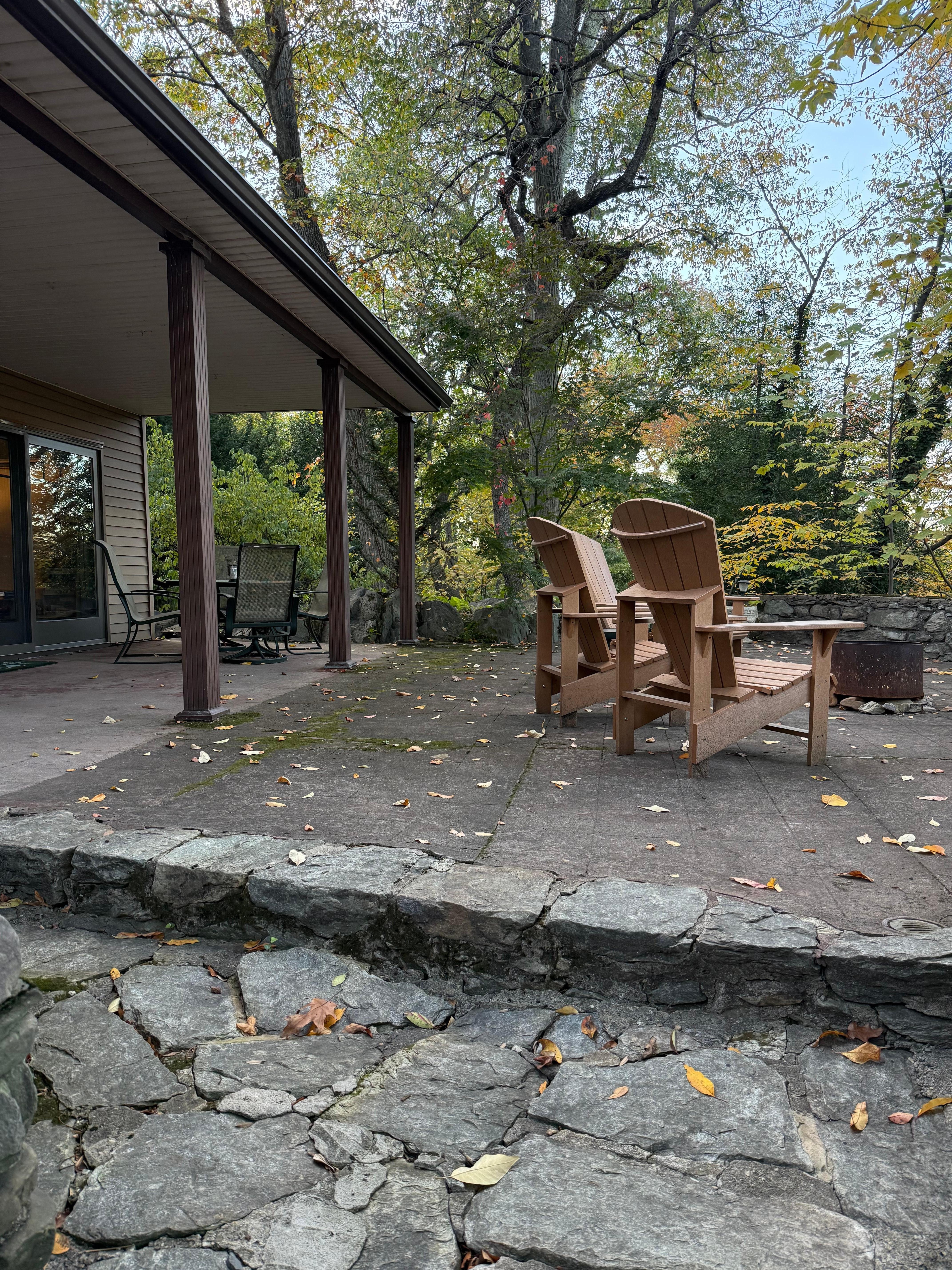 The patio is massive and beautiful.  It has a dining table under the overhang and comfortable Adirondack chairs with a fire pit overlooking the back.  A perfect place to relax!!!!!