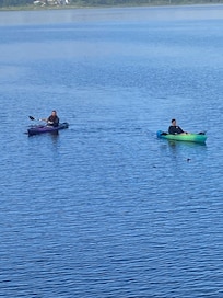 Kayaking in the morning while the water is calm.