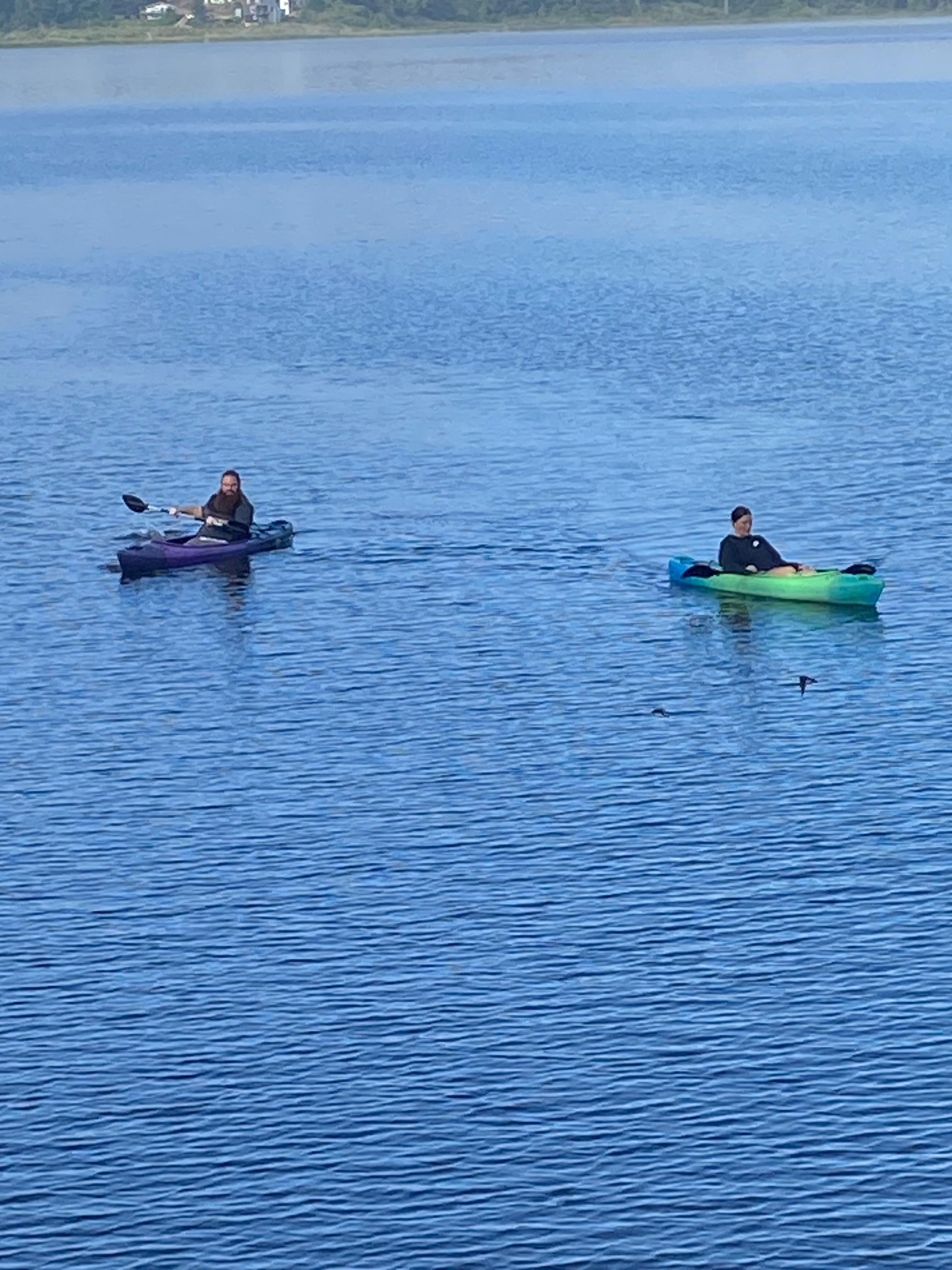 Kayaking in the morning while the water is calm.  