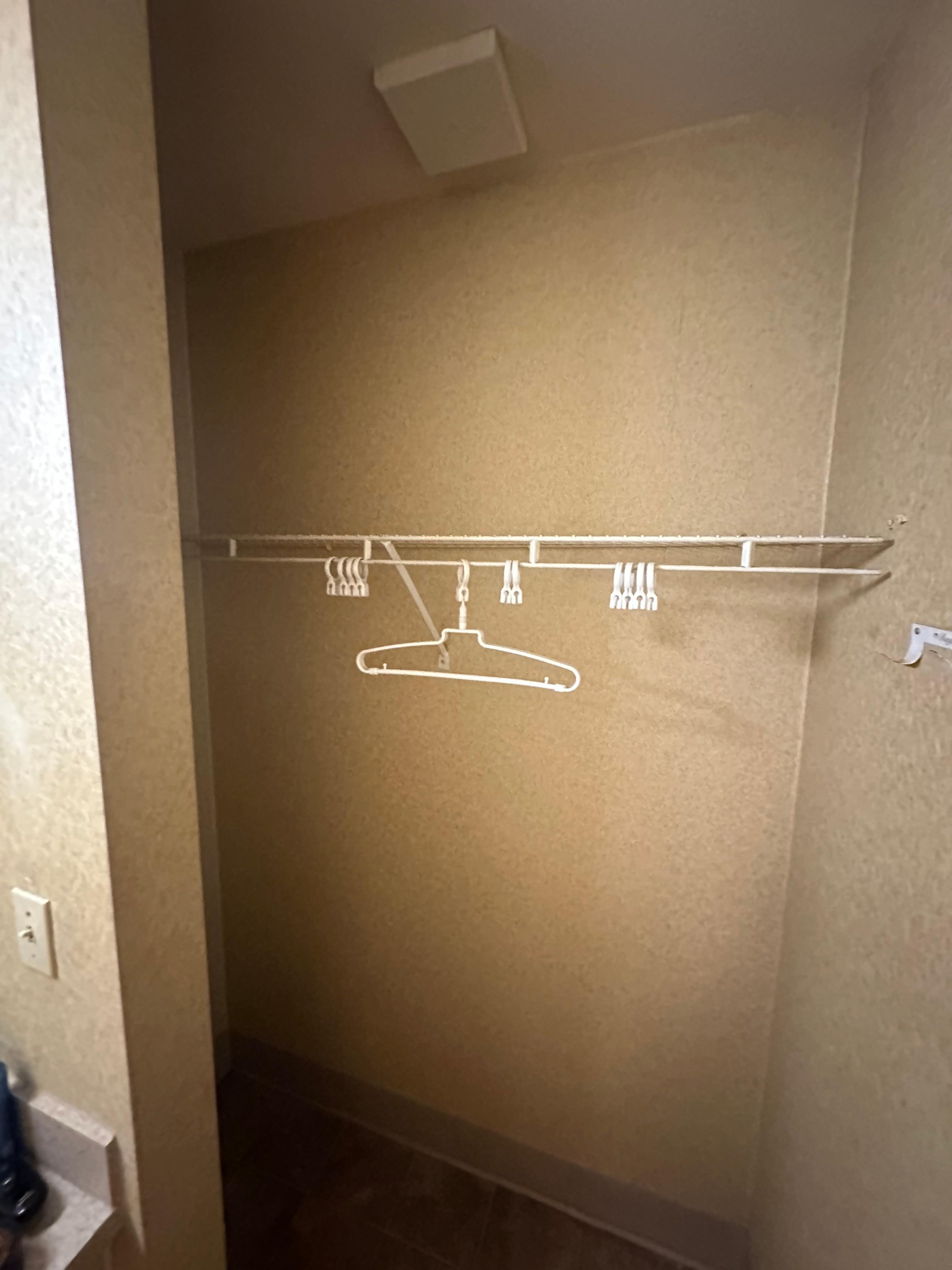 Only one hanger in the closet and no suitcase stand