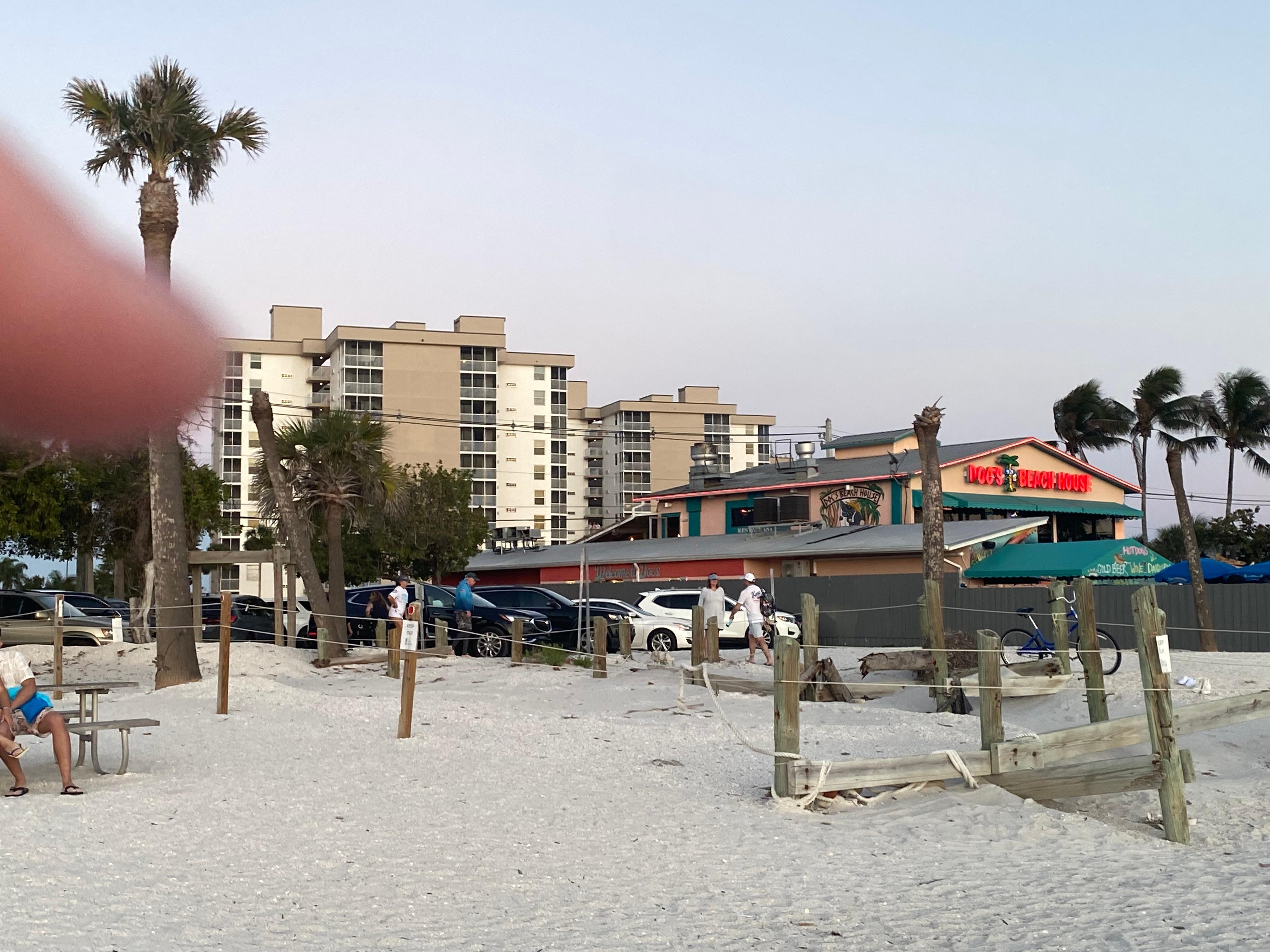 Pointing to condo from beach