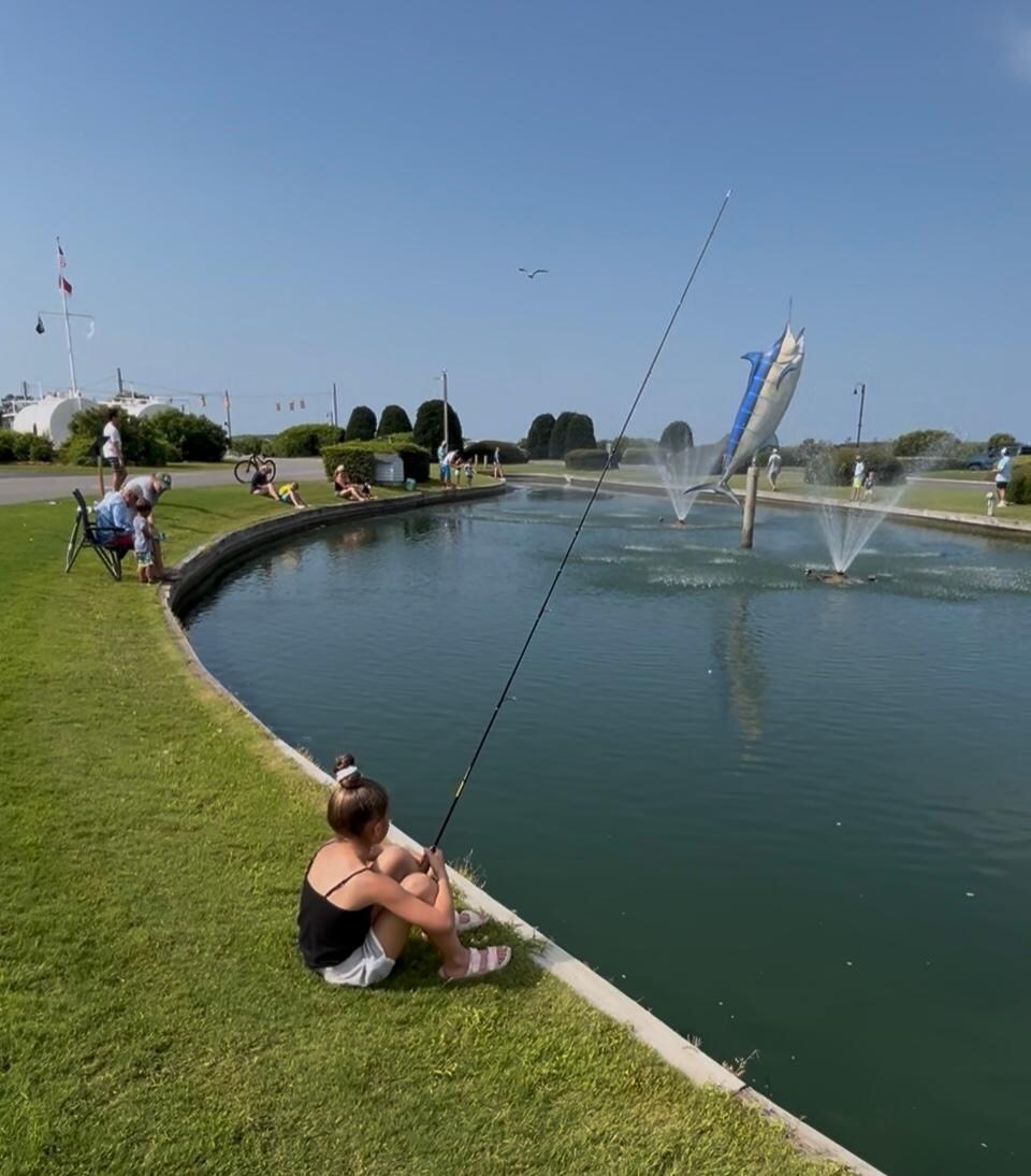 Kids fishing tournament in front pond