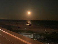 Moon view from main deck. Proximity to beach is unbeatable.