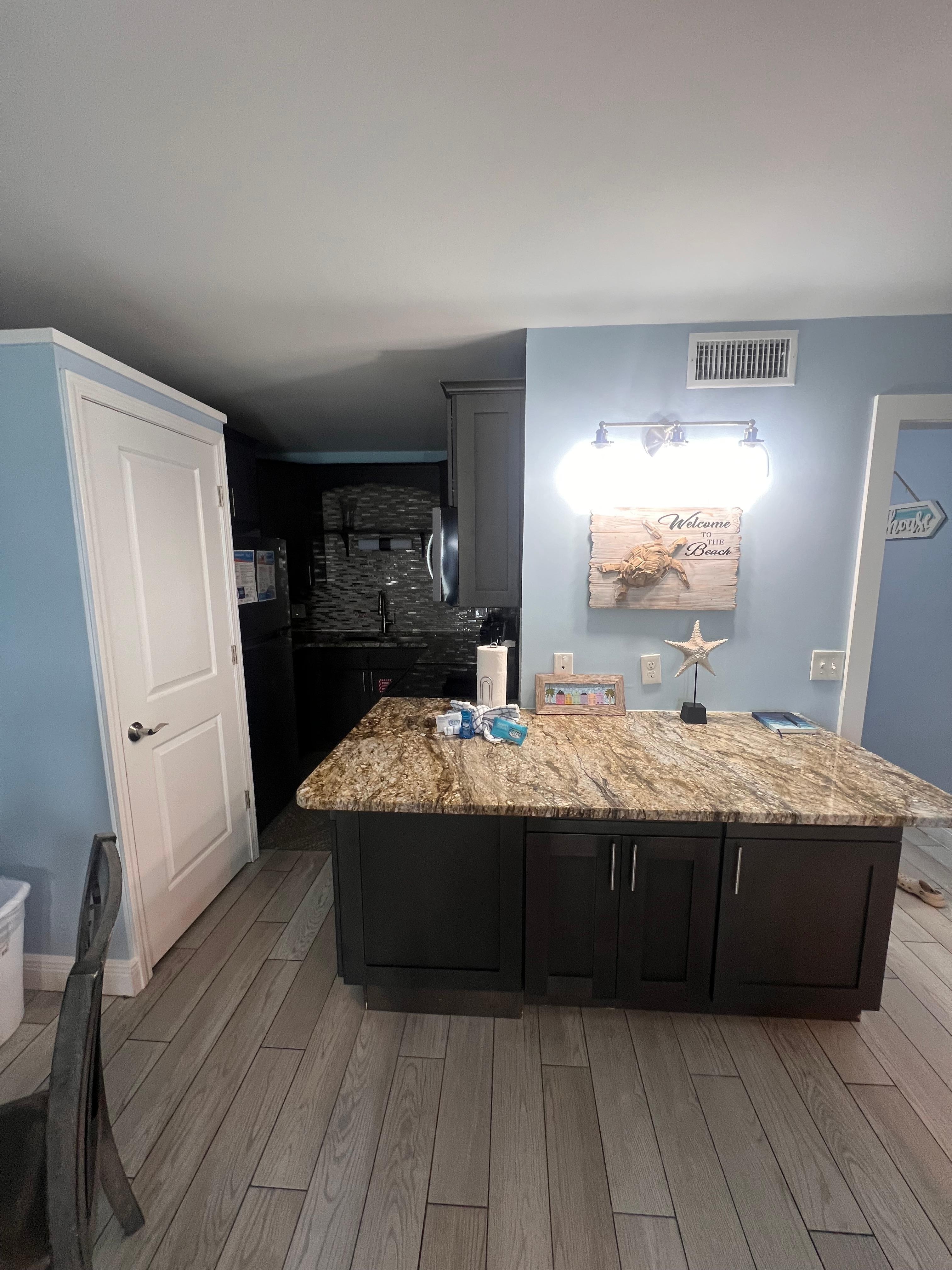 Kitchen area and washer and dryer 