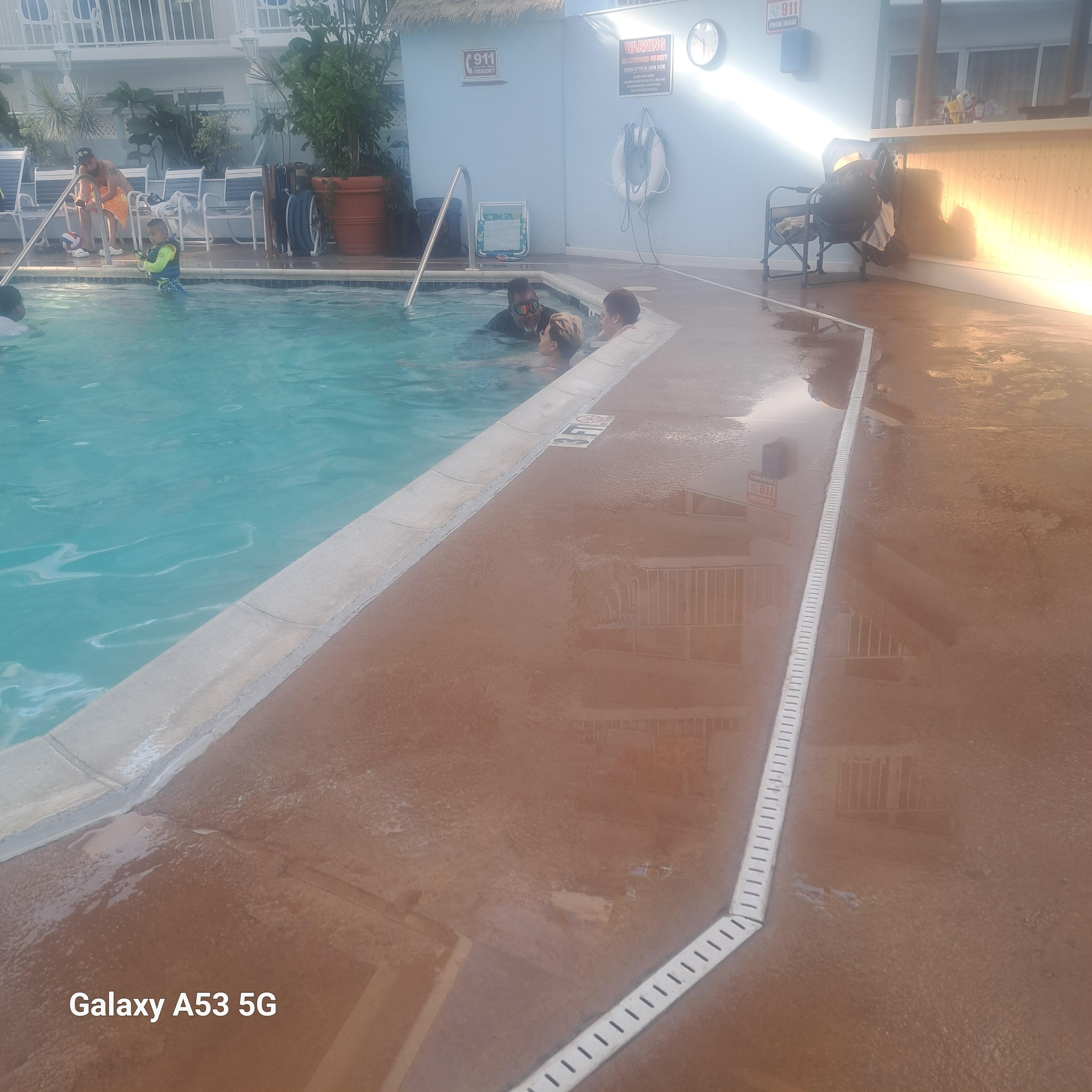My hubby and daughters enjoying the pool