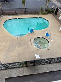 This is the "nice view of the pool" from our balcony. The hot tub clearly is out of order, the pool is gross, and there is a homeless person just hanging out outside of the see through fence.