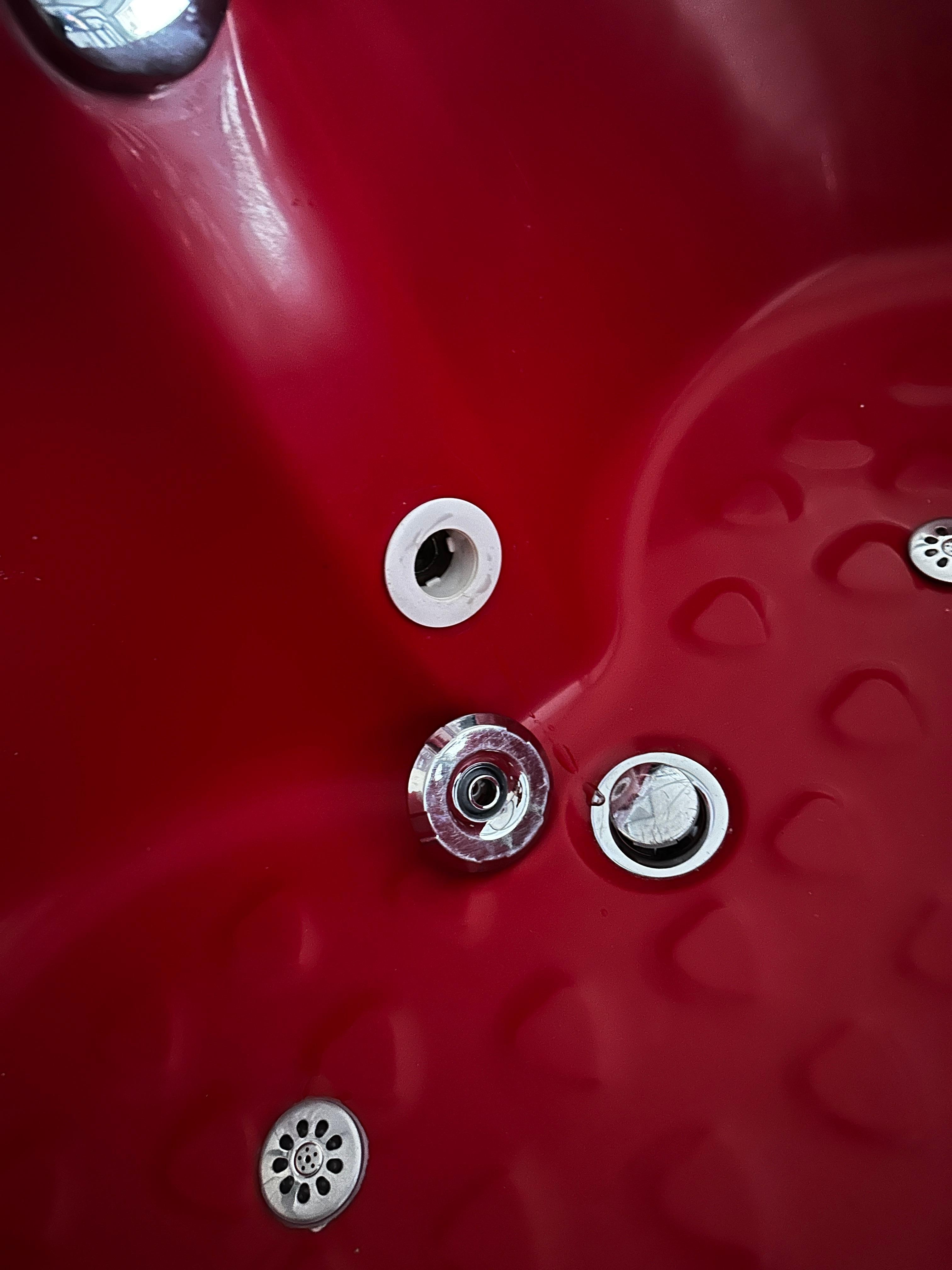 Jet that fell off once the pumps were turned on.  Seems like a known problem as there is glue/silicone here