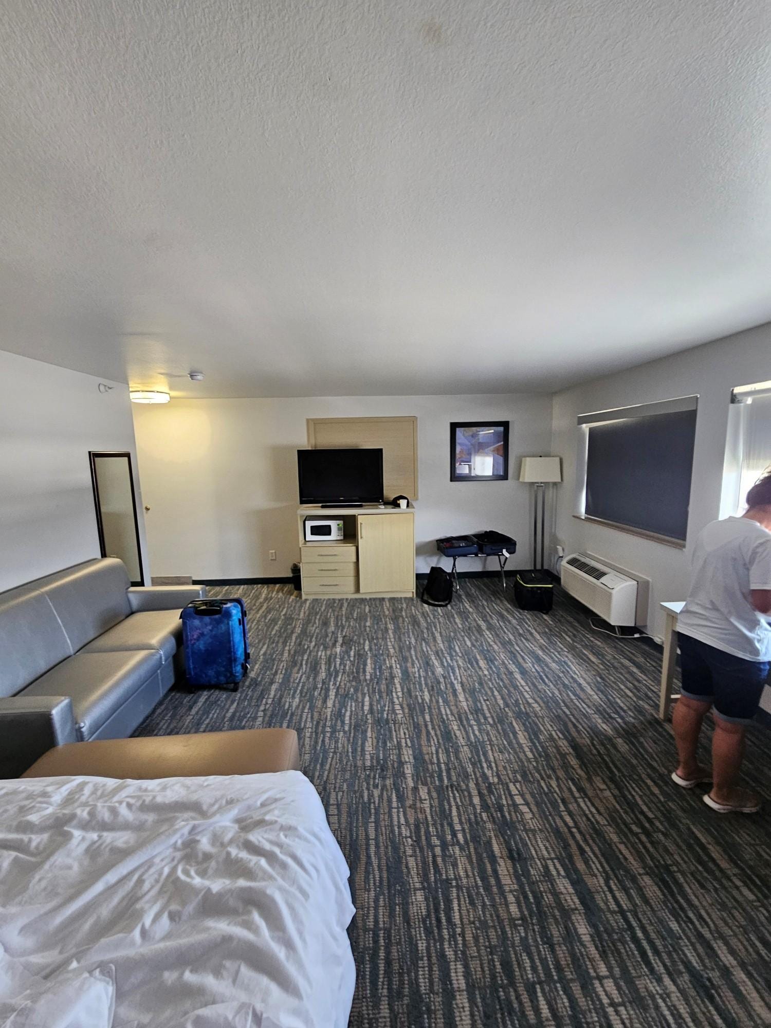 Room set up weird, tiny TV way too far from bed.