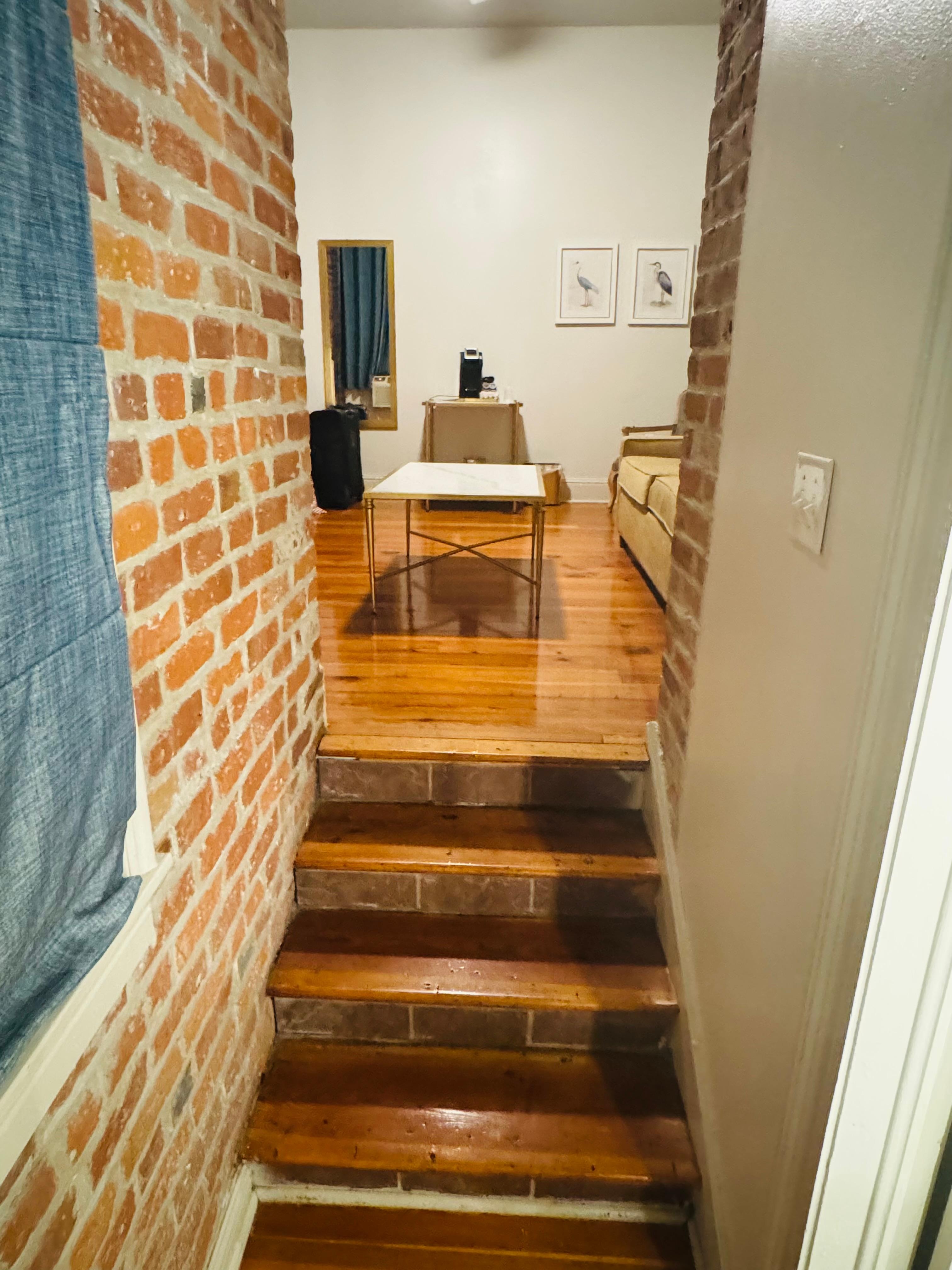 A little set of stairs between living room and hall/bathroom