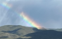 Beautiful rainbow over the mountains out the back
