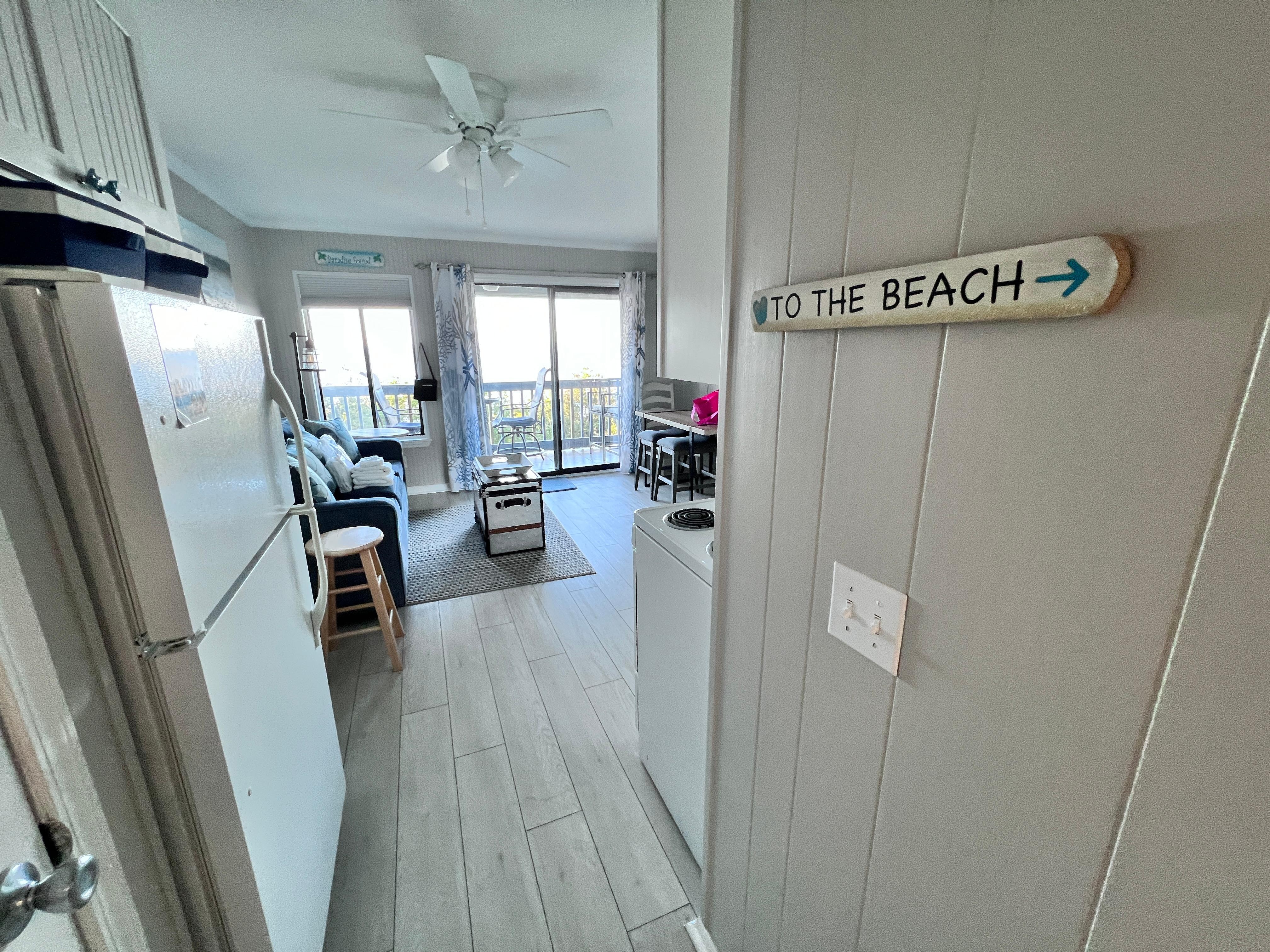 Main hall toward living/kitchen/eating/balcony/oceanfront