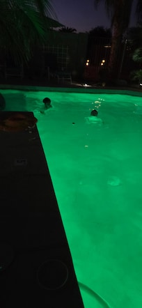 Night swimming in the changing pool colors