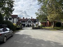 The approach to the hotel and parking area.
