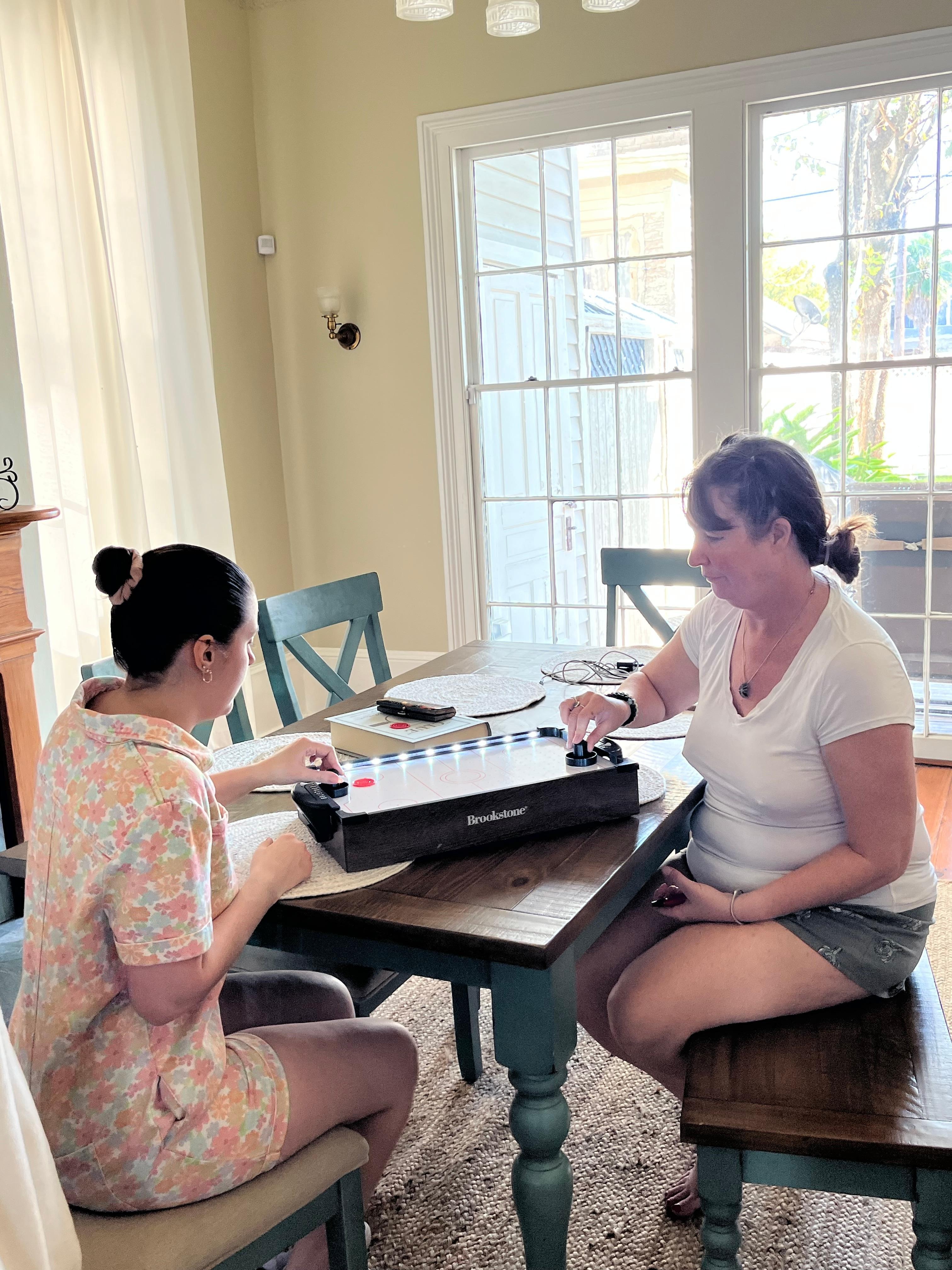My two favorite people playing air hockey 