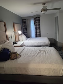 The bedroom has a sliding door