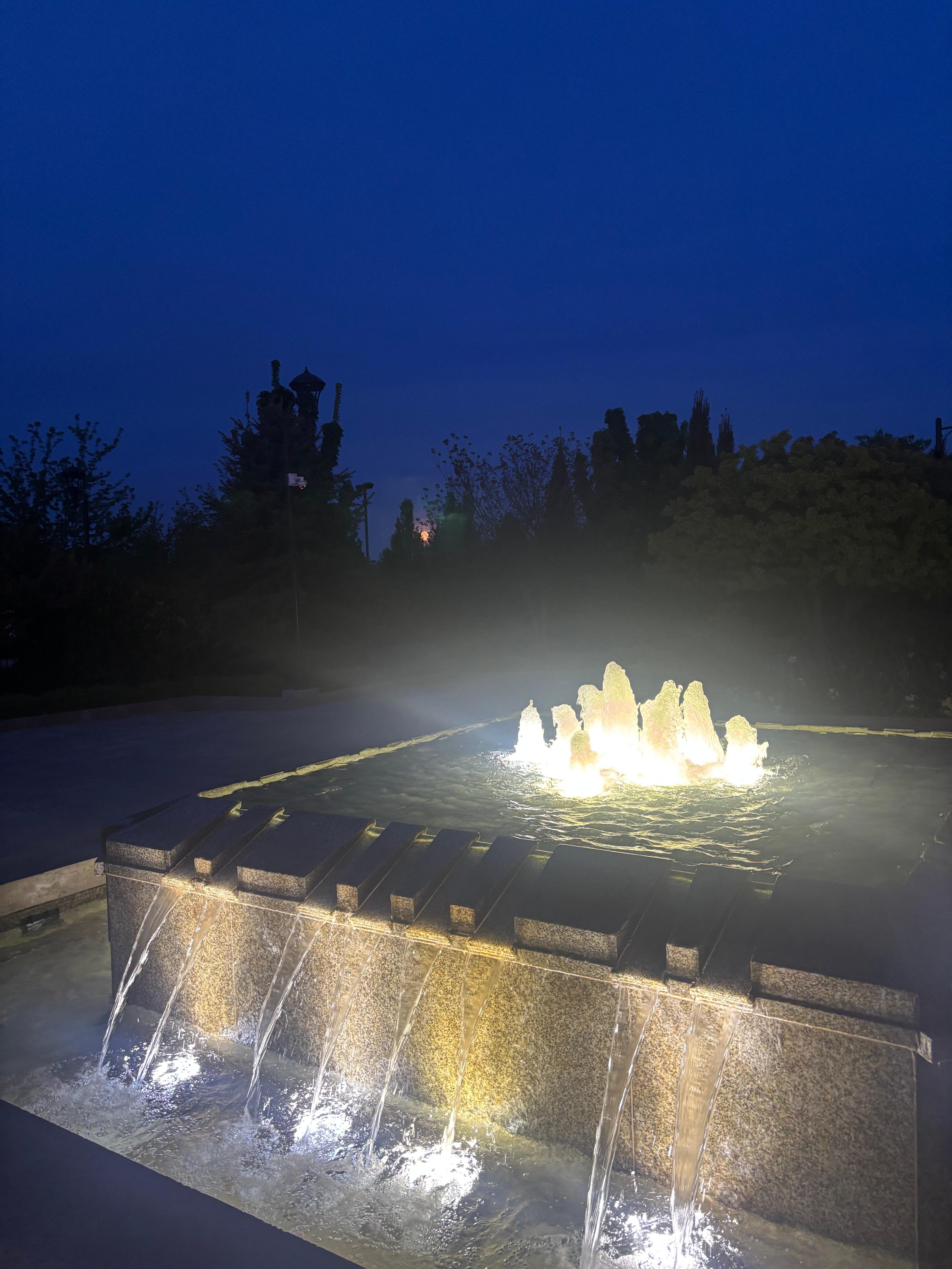 Moon set over fountain.