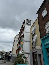 Outside of hotel  
(White shipping containers)