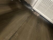 Rock holding A/C unit in place