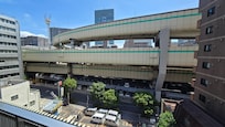 The view from the hotel corridor. You can see the elevated highways as well as T-CAT and Suitengumae station from the hotel.