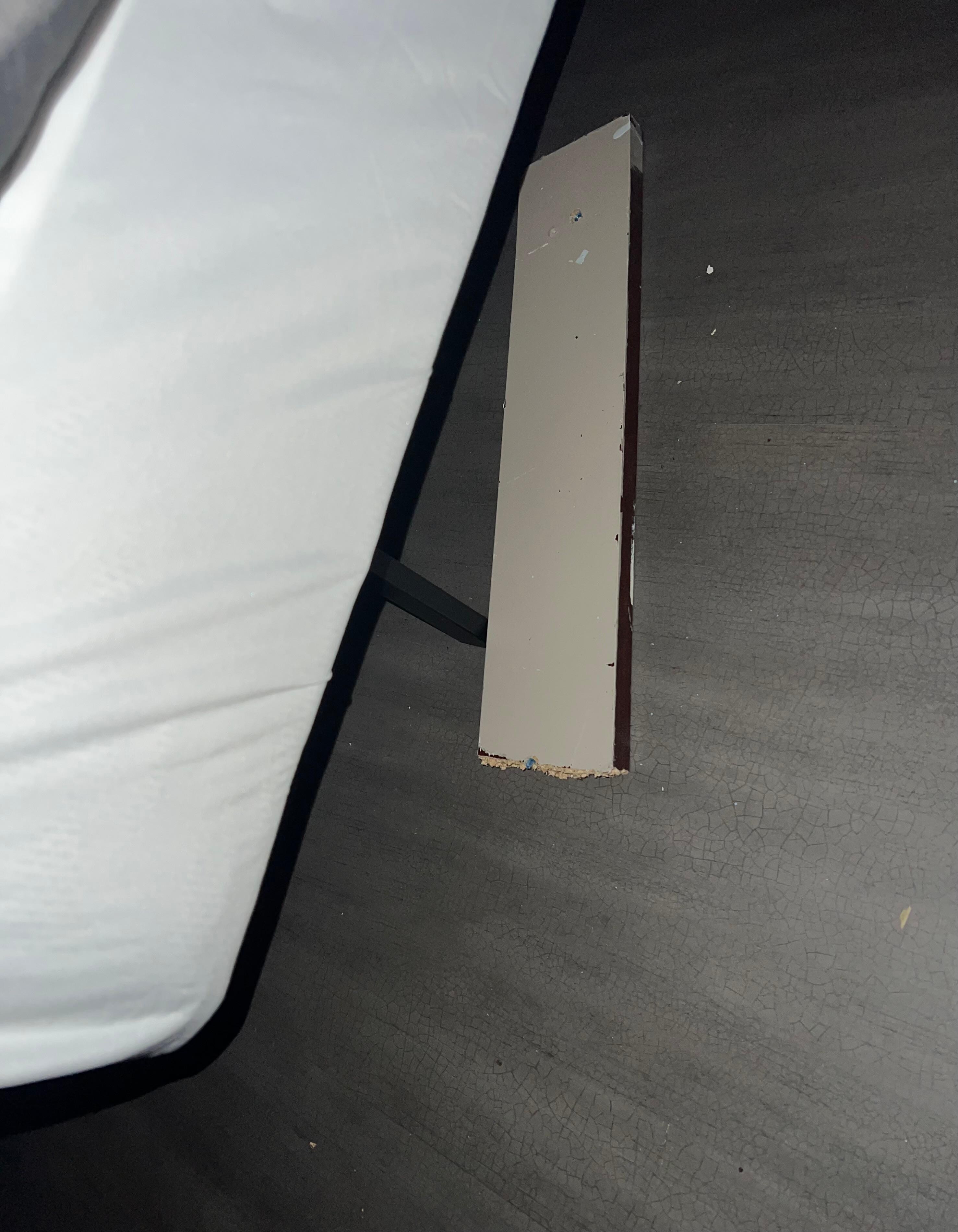 This is the wood piece they used to prop the bed with. 