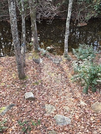 Cute little chairs by the creek