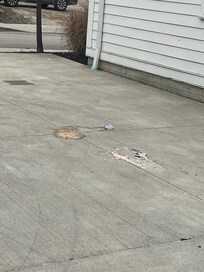 Picture of vomit in the parking lot where the people were blocking our entry into the house.