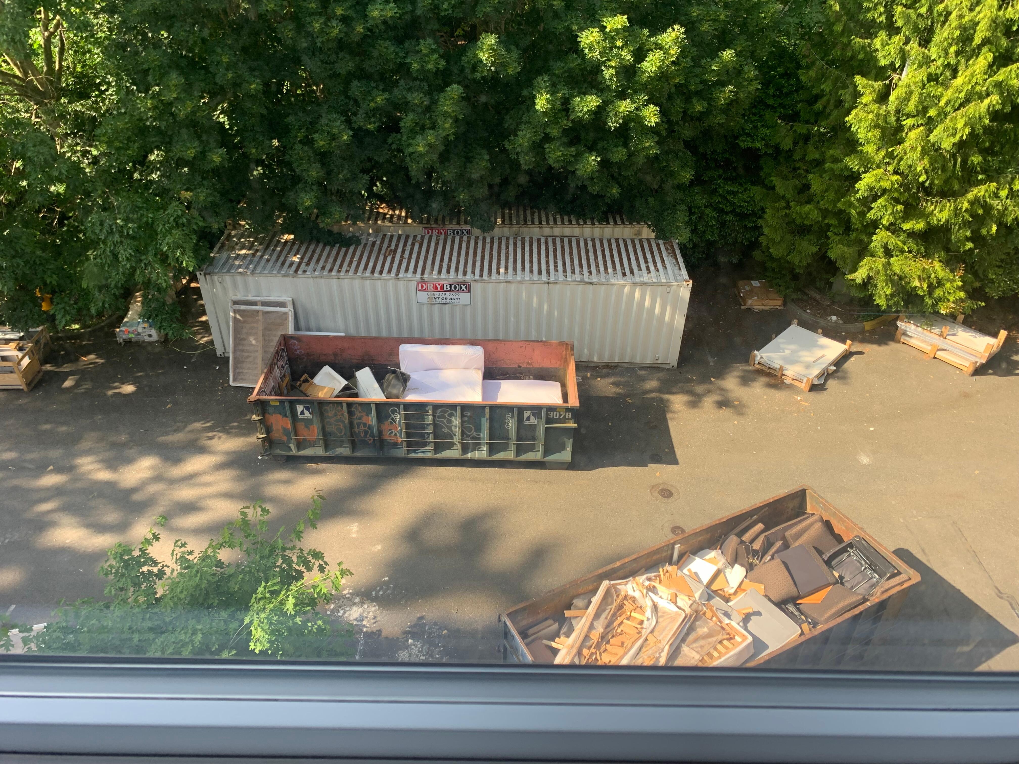 Dumpster outside our window which included daily dumps of mattresses