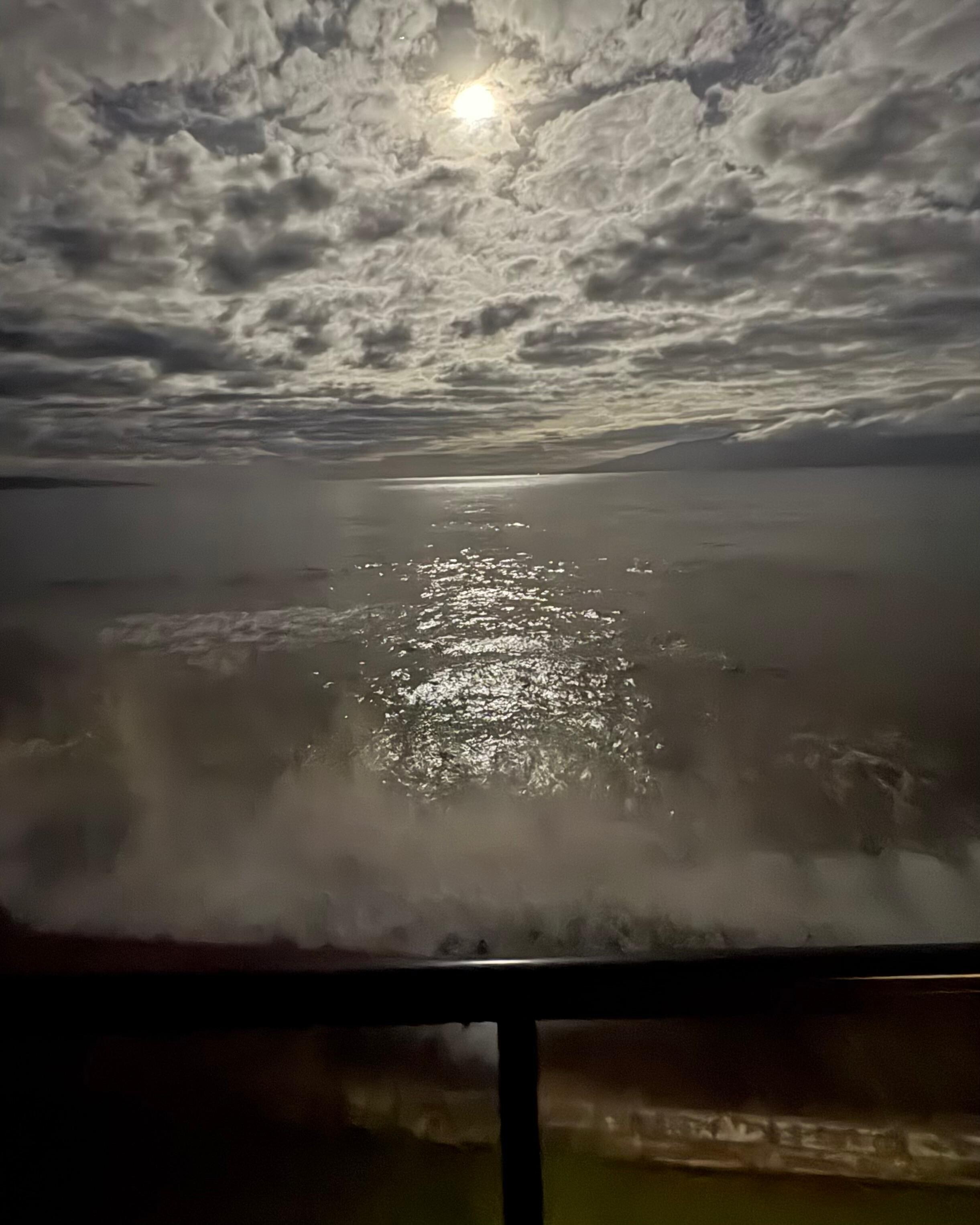 Waves crashing against the seawall below