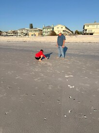 This was just before sunset on day of check-in. The buildings in the background are slender and the condo is just next to the beach really, right there beyond the public access opening.