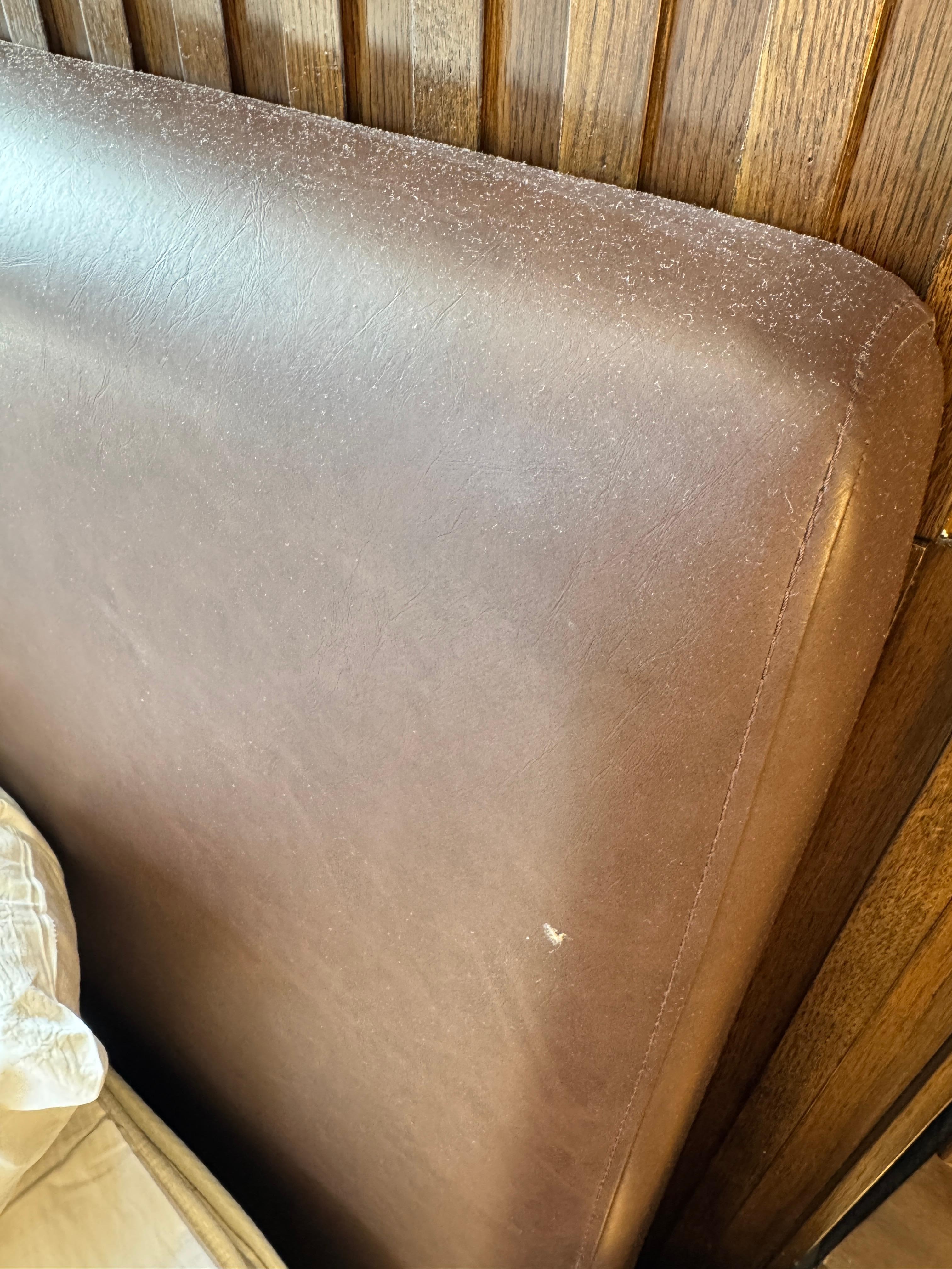 Inexplicable gunk on headboard (and around the room), plus thick white dust covering most surfaces