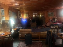 Living room. Dim with all lights on.