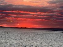 Sunset view of Harbor from back patio of property.