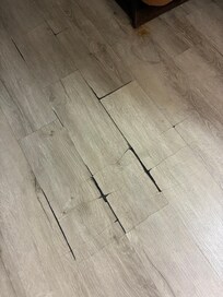 Broken flooring all over room
