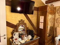 Coffee or tea? The refrigerator is located in the armoire as well.