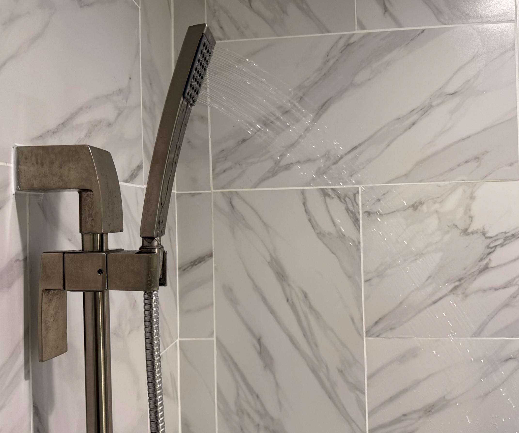 Water is 100% turned on, barley enough to get the soap off your body, much less out of your hair