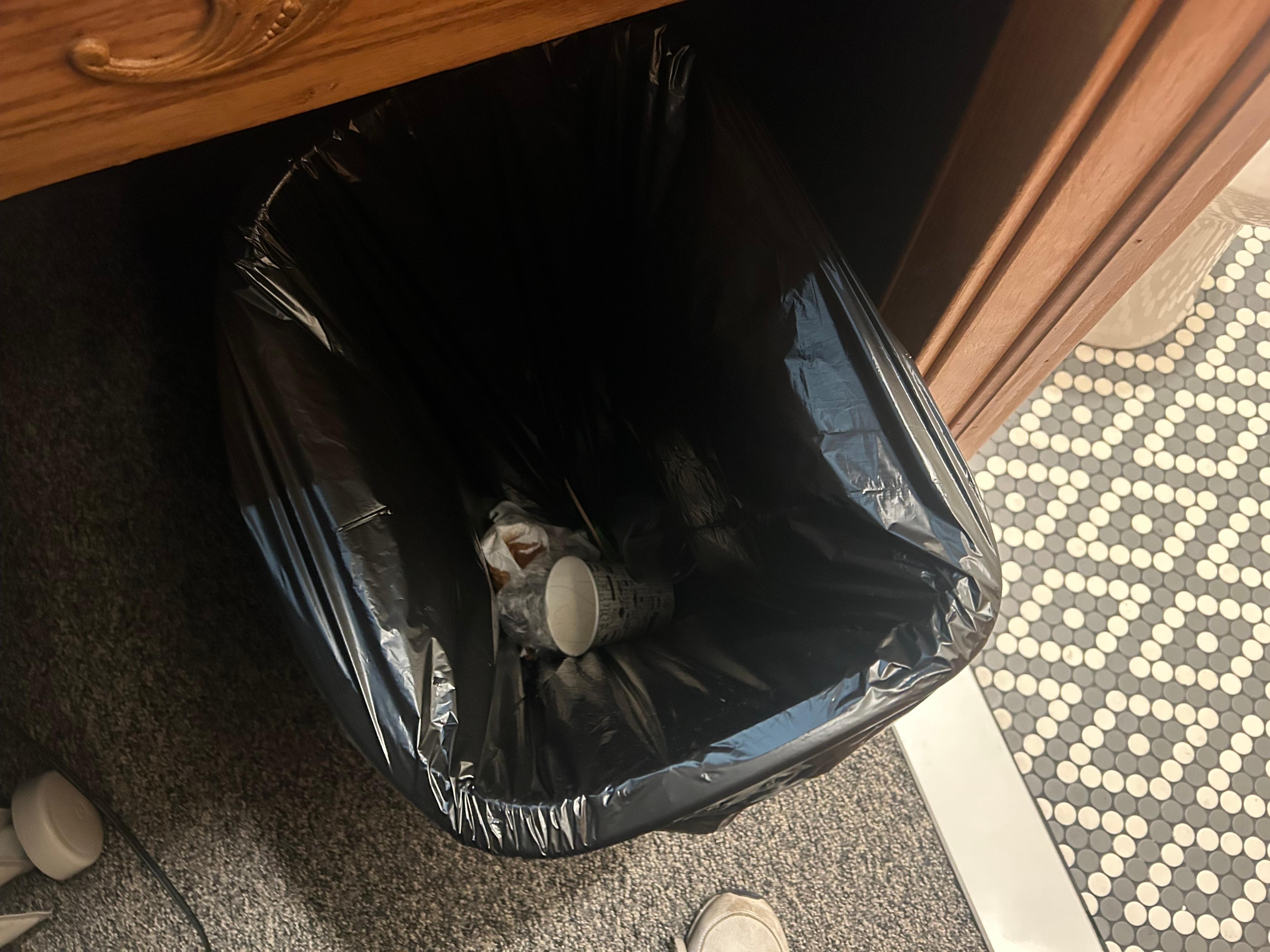 Picture of waste basket not cleaned 