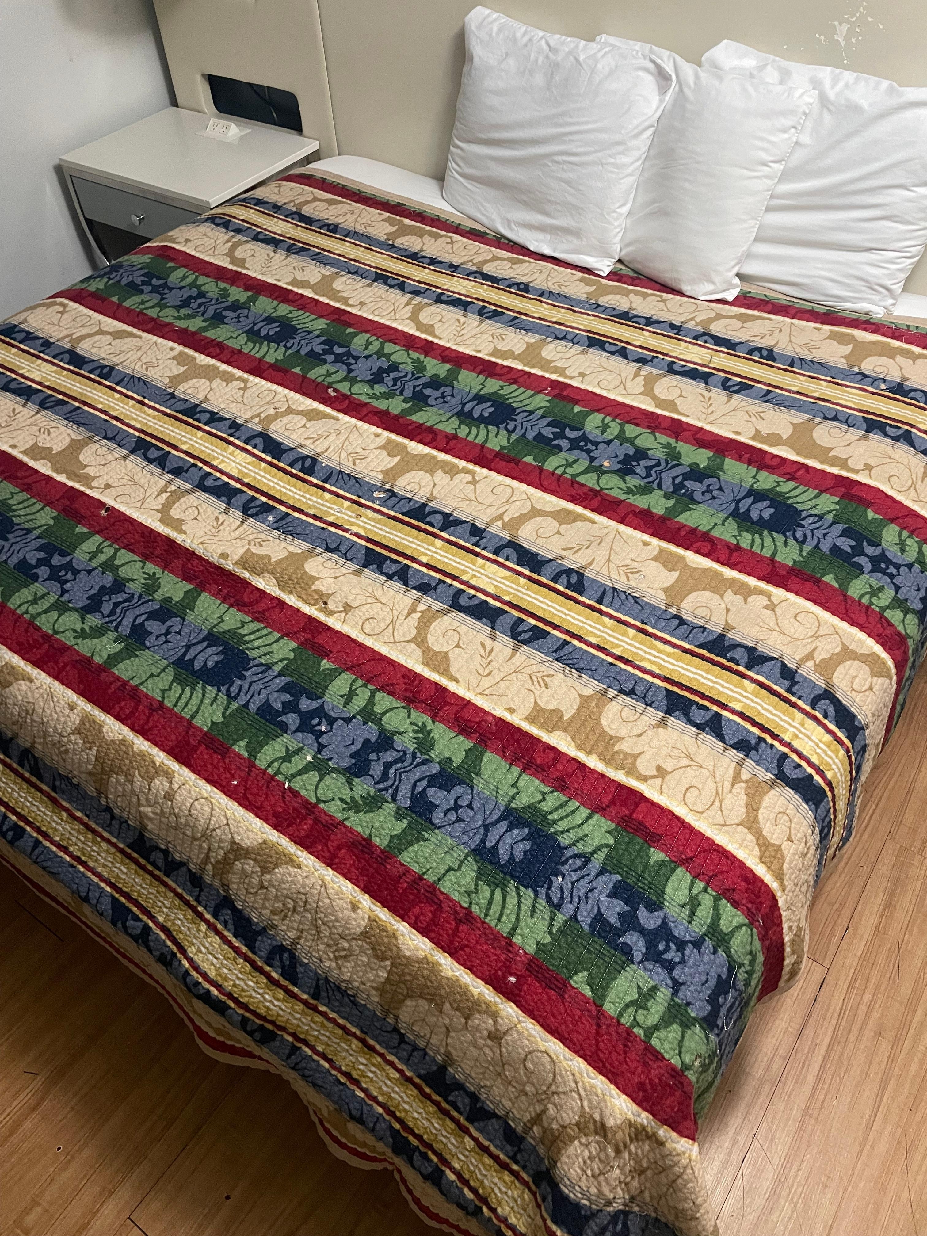 Bed covered with cigarette holes 