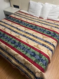 Bed covered with cigarette holes