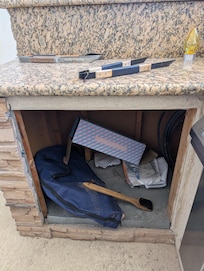 Unfinished outdoor kitchen... Just looks sloppy.