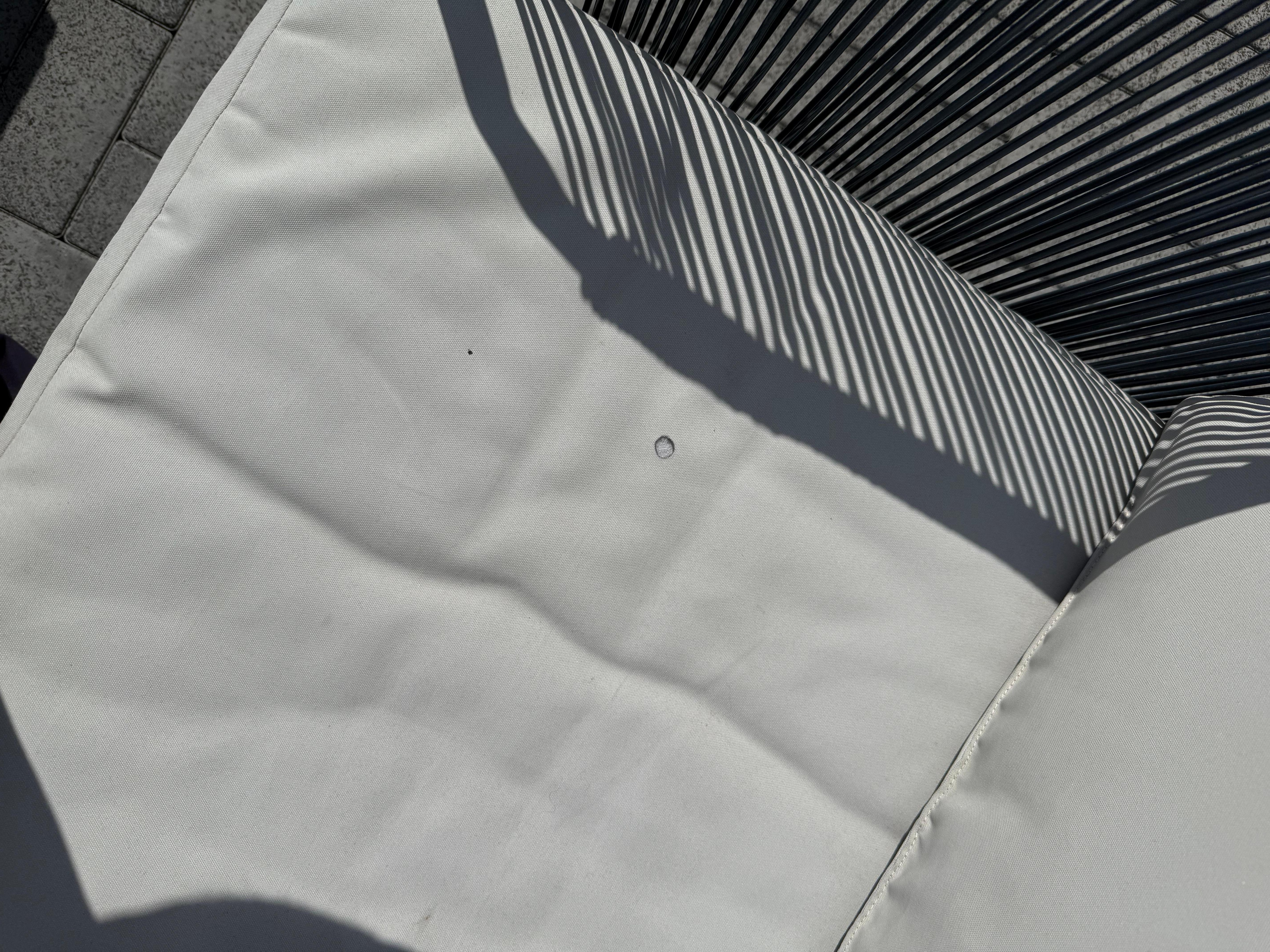 Actual rooftop cushion with cigarette burn