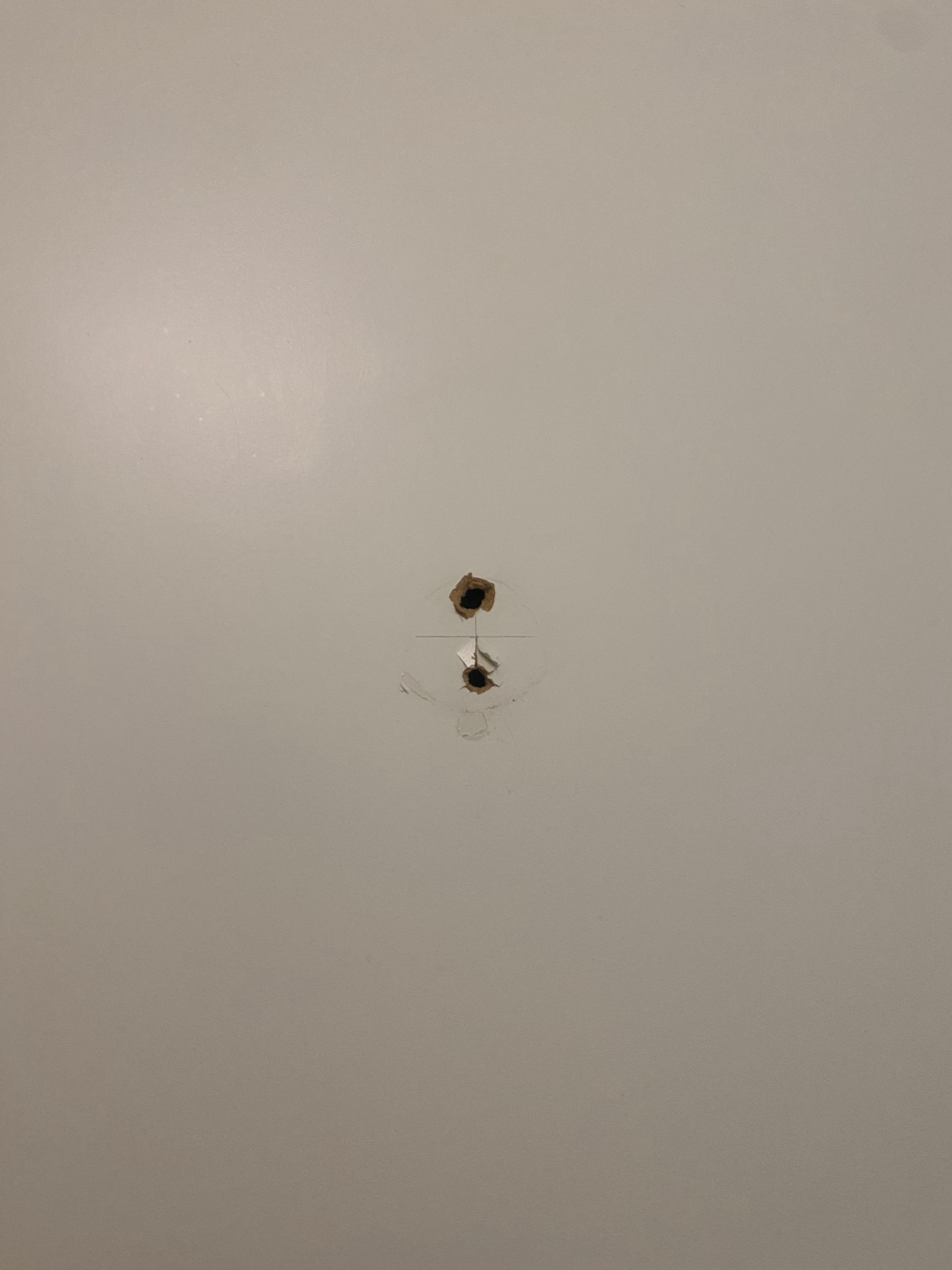 Holes in bathroom where I assume hooks for towels used to be