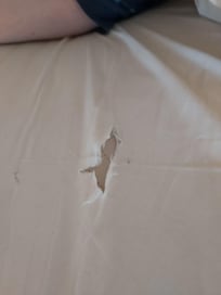 Additional tear in linen