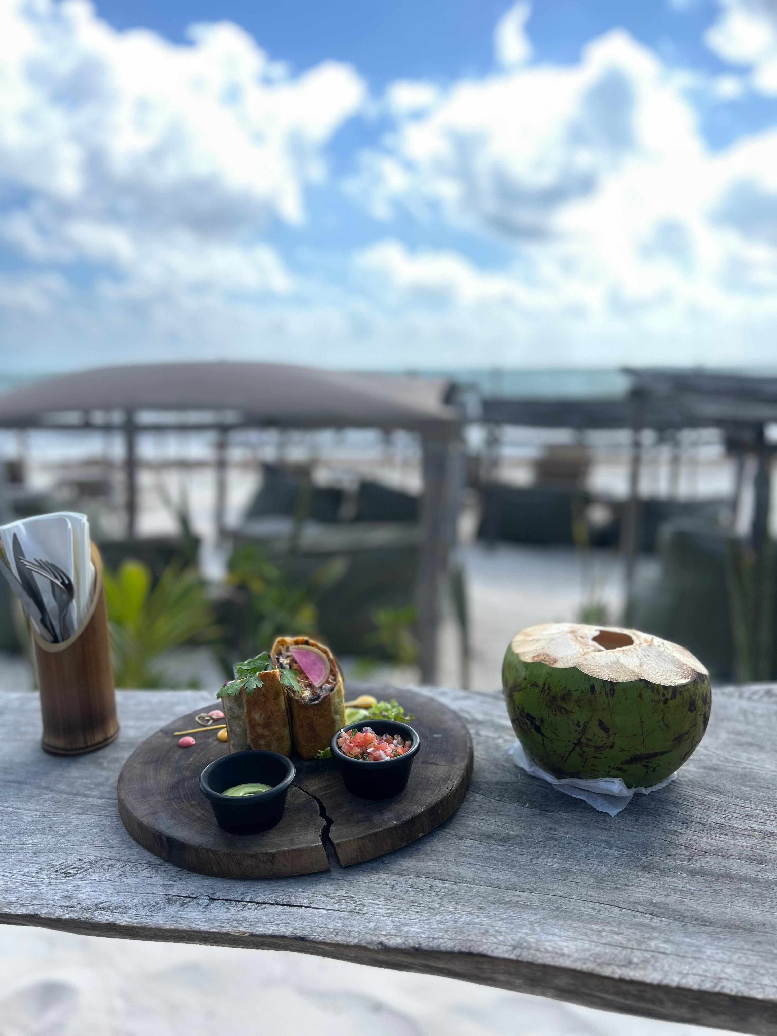 Breakfast burrito add on and coconut from the vendor accross the street