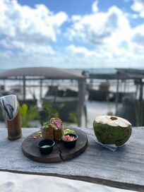 Breakfast burrito add on and coconut from the vendor accross the street