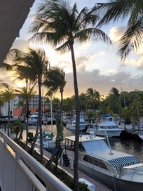 View of sea channel with boat slips and dock walk