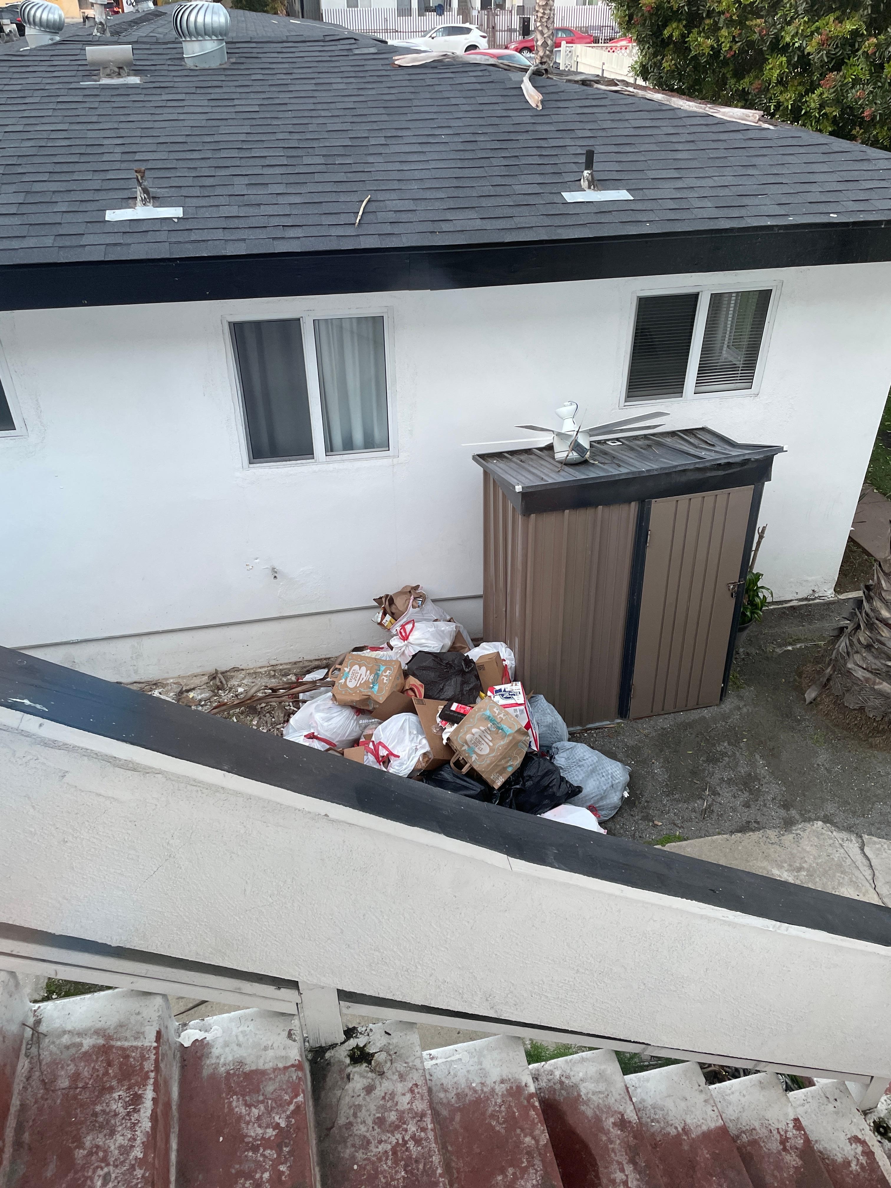 Here is the pile of trash below the stairs 