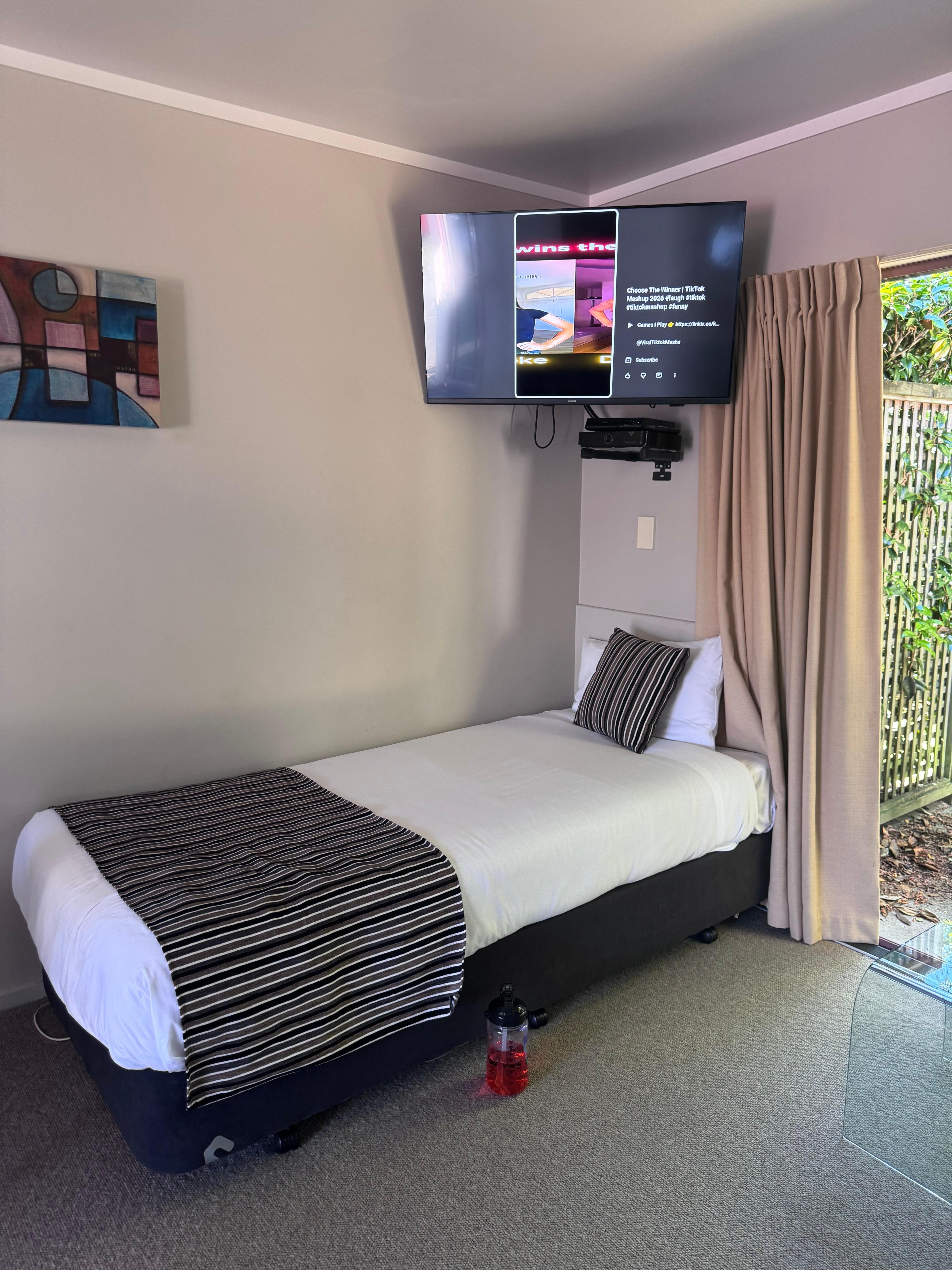 X2. single Beds in lounge 
Has 2 wicker seats 
Small Dining table w 4 Seats 
Full kitchen w bar fridge 